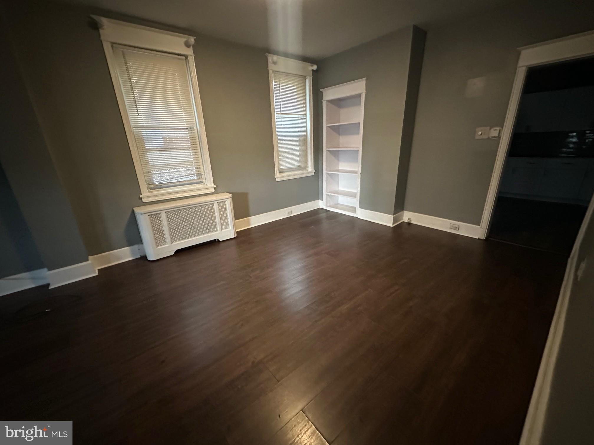 2349 Duncan Street Philadelphia, PA 19124 - Photo 4 of 13 an empty room with wooden floor and windows