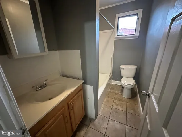 a bathroom with a sink and toilet
