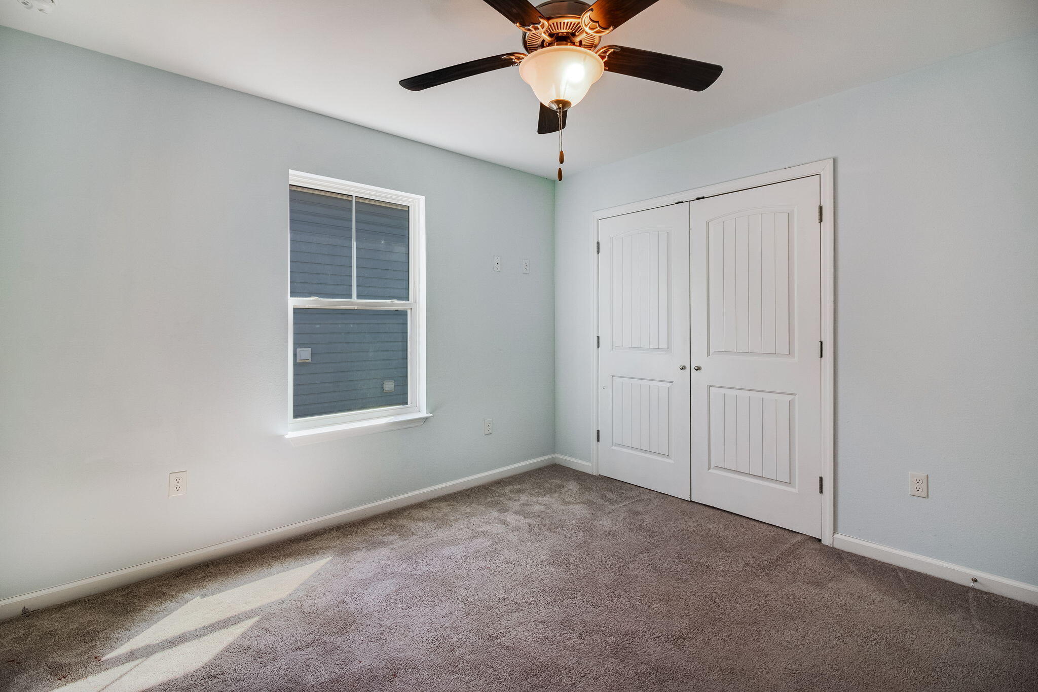 189 Johnson Court Crestview, FL 32536 - Photo 15 of 20 an empty room with windows and fan