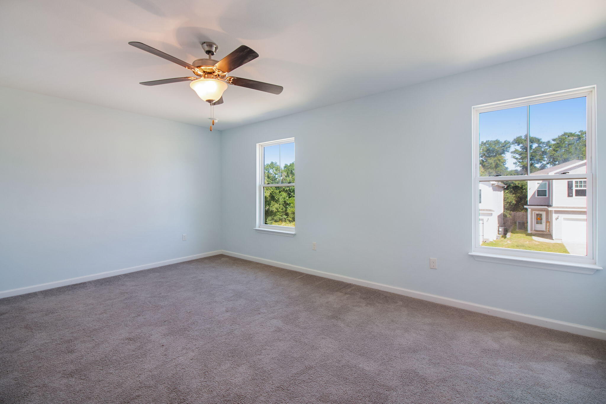 189 Johnson Court Crestview, FL 32536 - Photo 17 of 20 an empty room with windows and fan