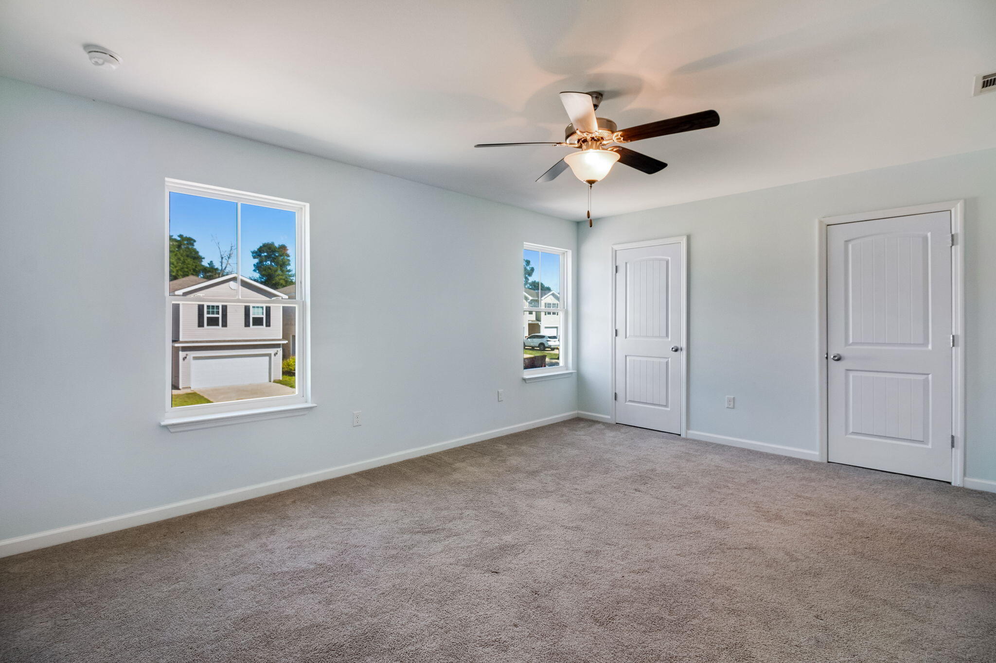 189 Johnson Court Crestview, FL 32536 - Photo 18 of 20 an empty room with windows and fan