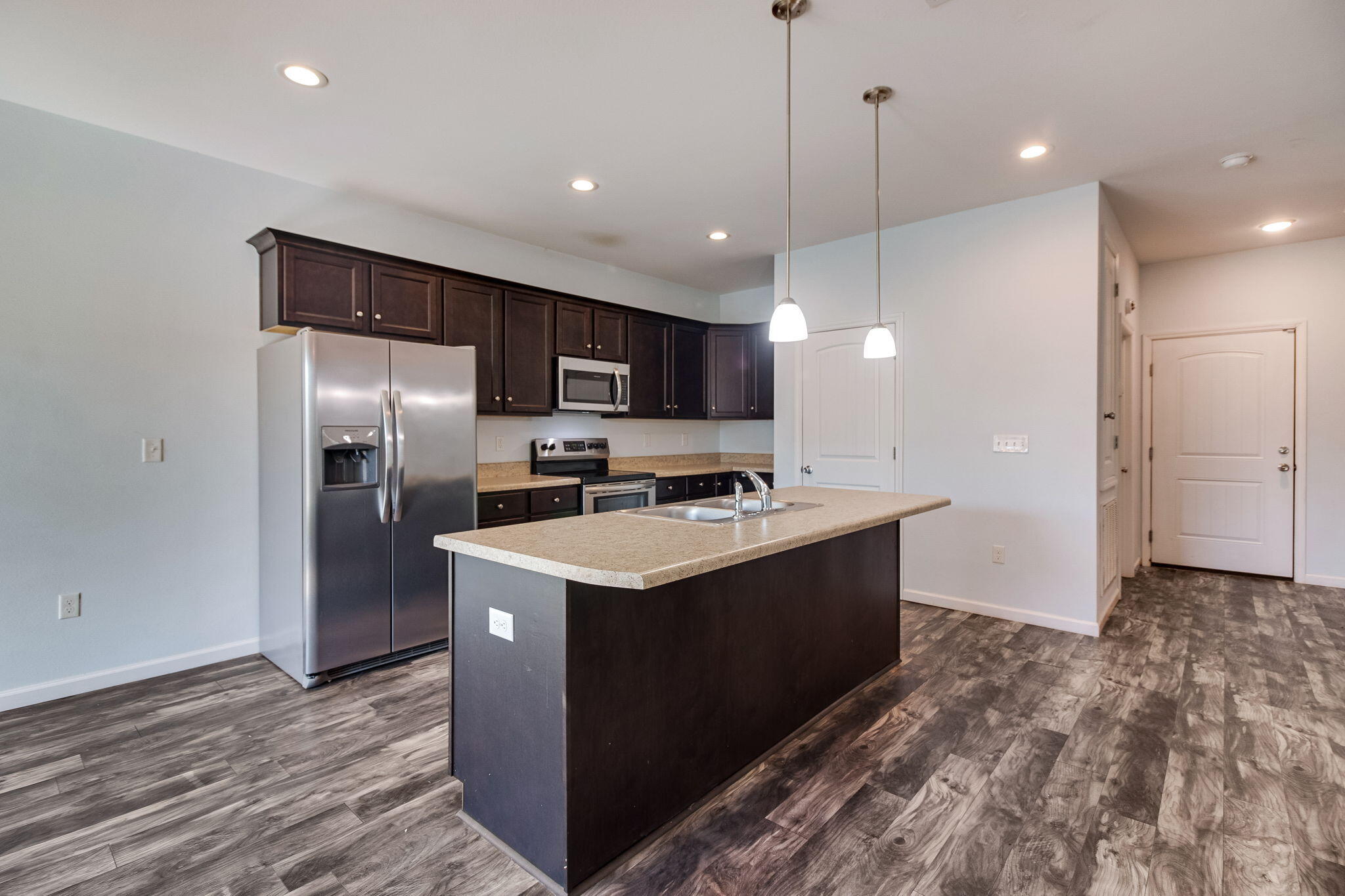189 Johnson Court Crestview, FL 32536 - Photo 4 of 20 a kitchen with kitchen island a sink stainless steel appliances and cabinets