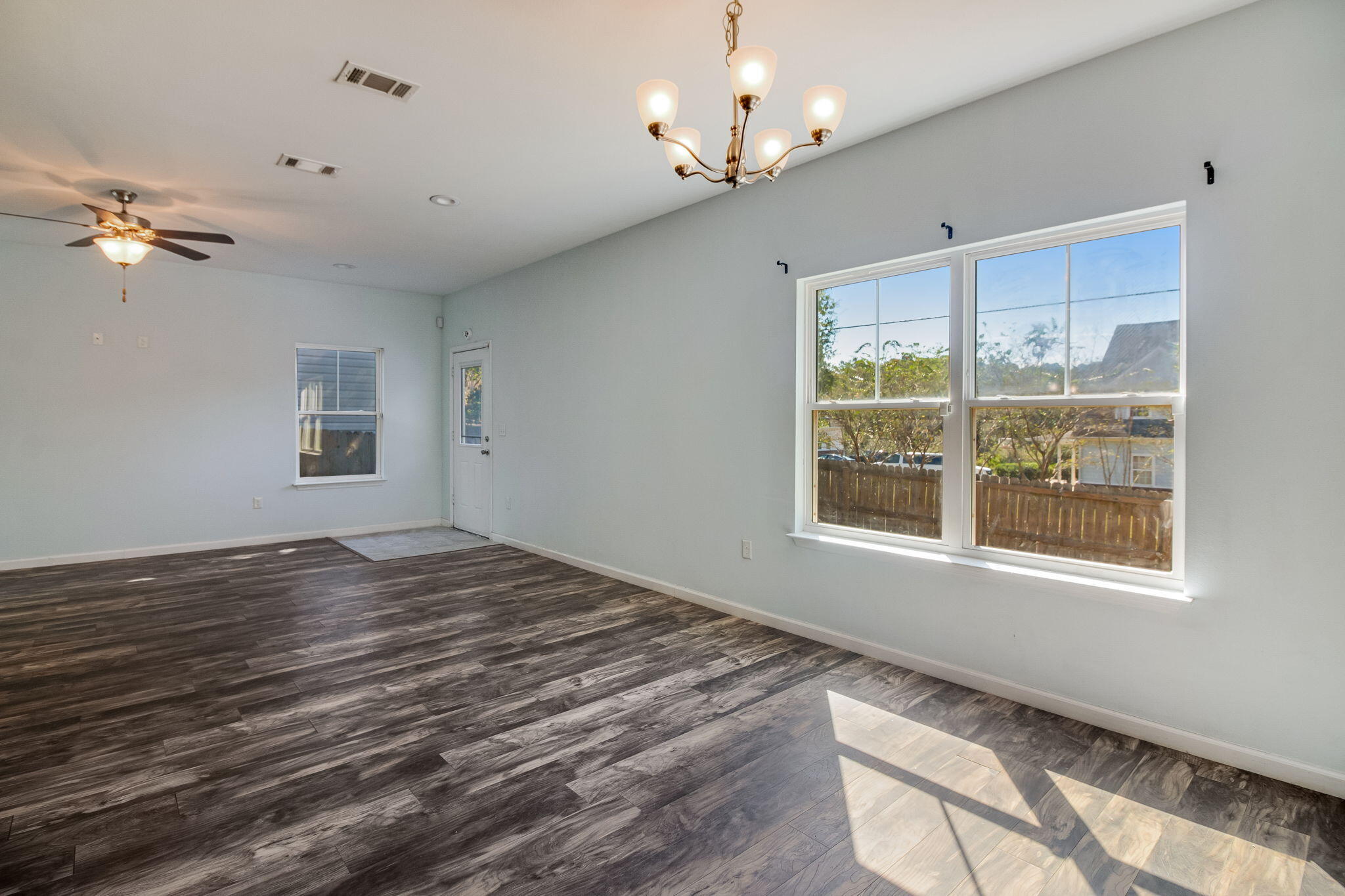 189 Johnson Court Crestview, FL 32536 - Photo 6 of 20 a view of empty room with wooden floor and fan