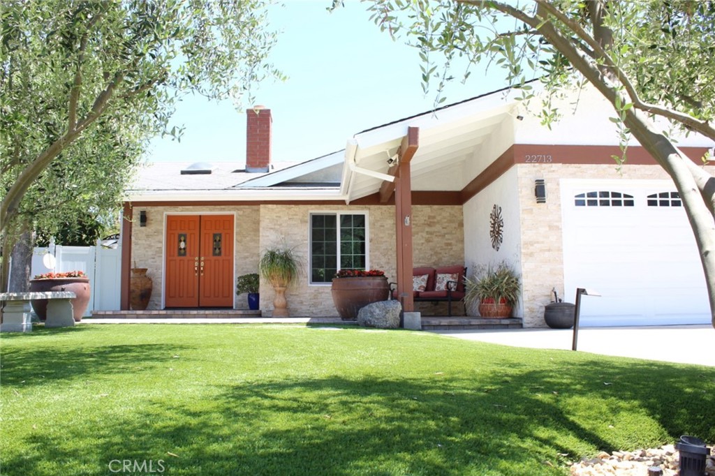 22713 Via Santa Rosa Mission Viejo, CA 92691 - Photo 1 of 1 a front view of house with yard and outdoor seating