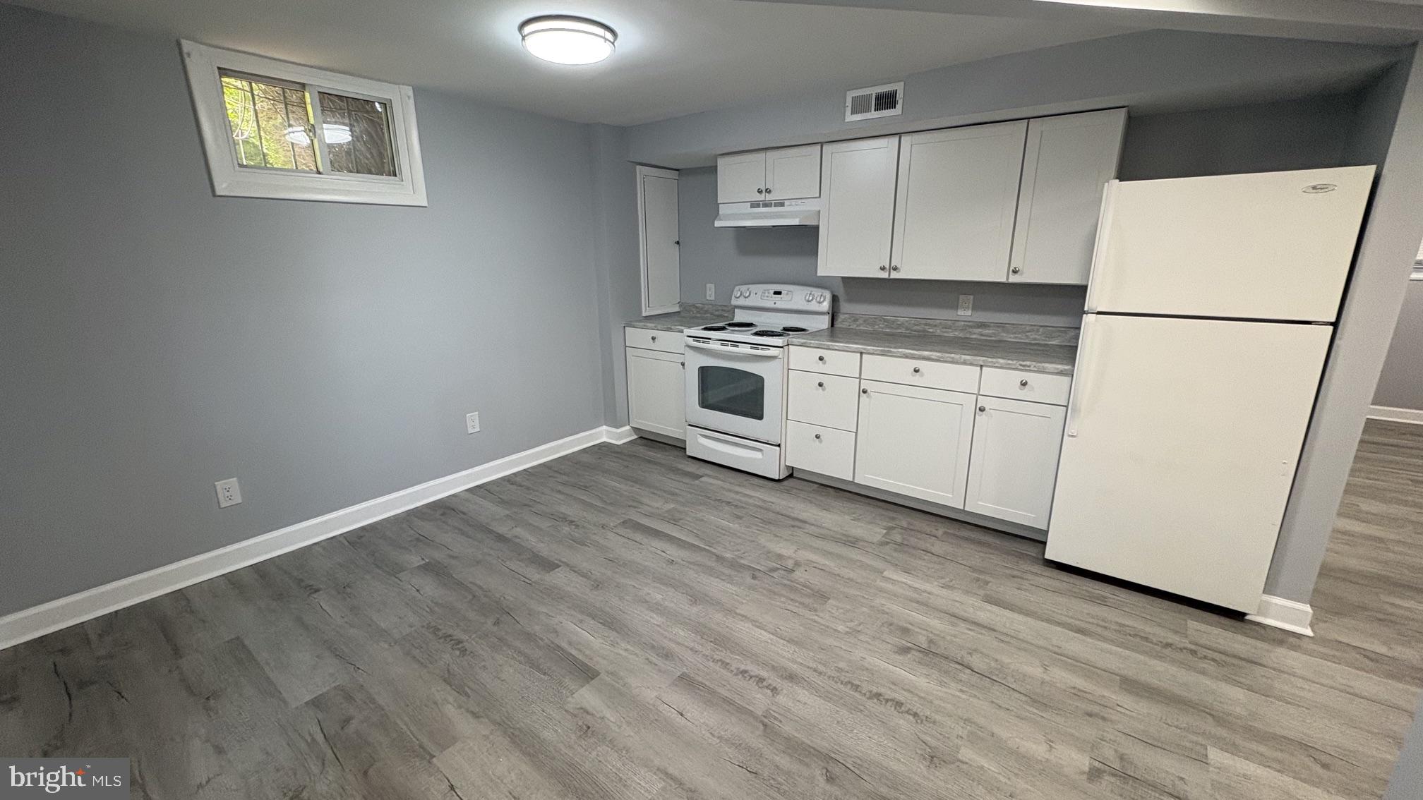 8001 Good Luck Road Lanham, MD 20706 - Photo 2 of 11 Modern kitchen with sleek finishes.