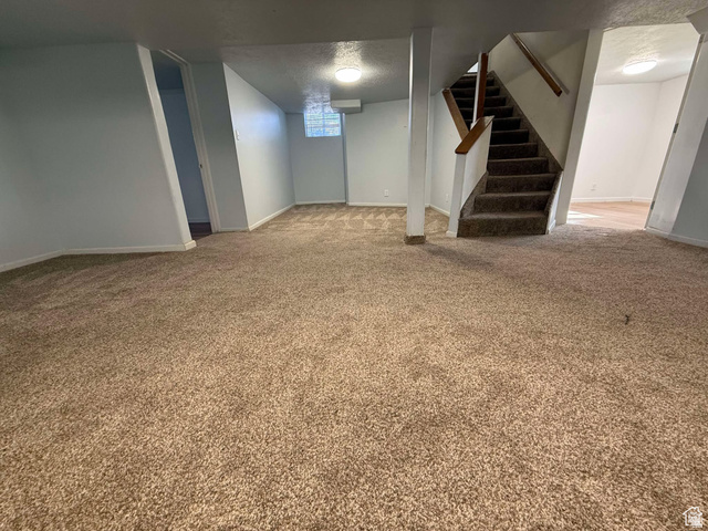 73 Garden Street Helper, UT 84526 - Photo 20 of 36 Basement with light colored carpet and a textured ceiling