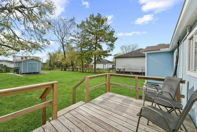 a view of a chair and tables on the deck