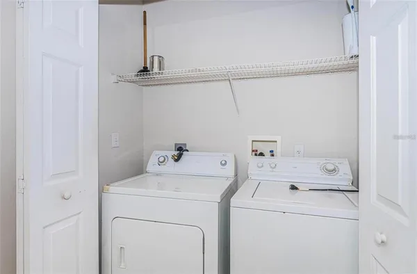 a view of storage and utility room with washer and dryer