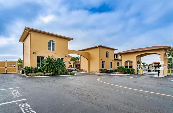 a view of a hallway with closet and front door