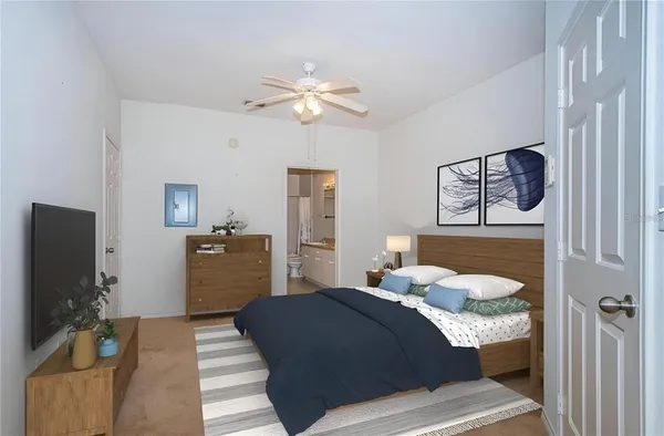 a bedroom with a bed and dresser