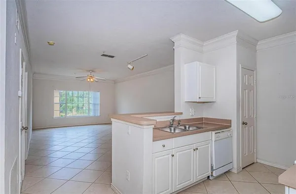 a kitchen that has a sink and a stove