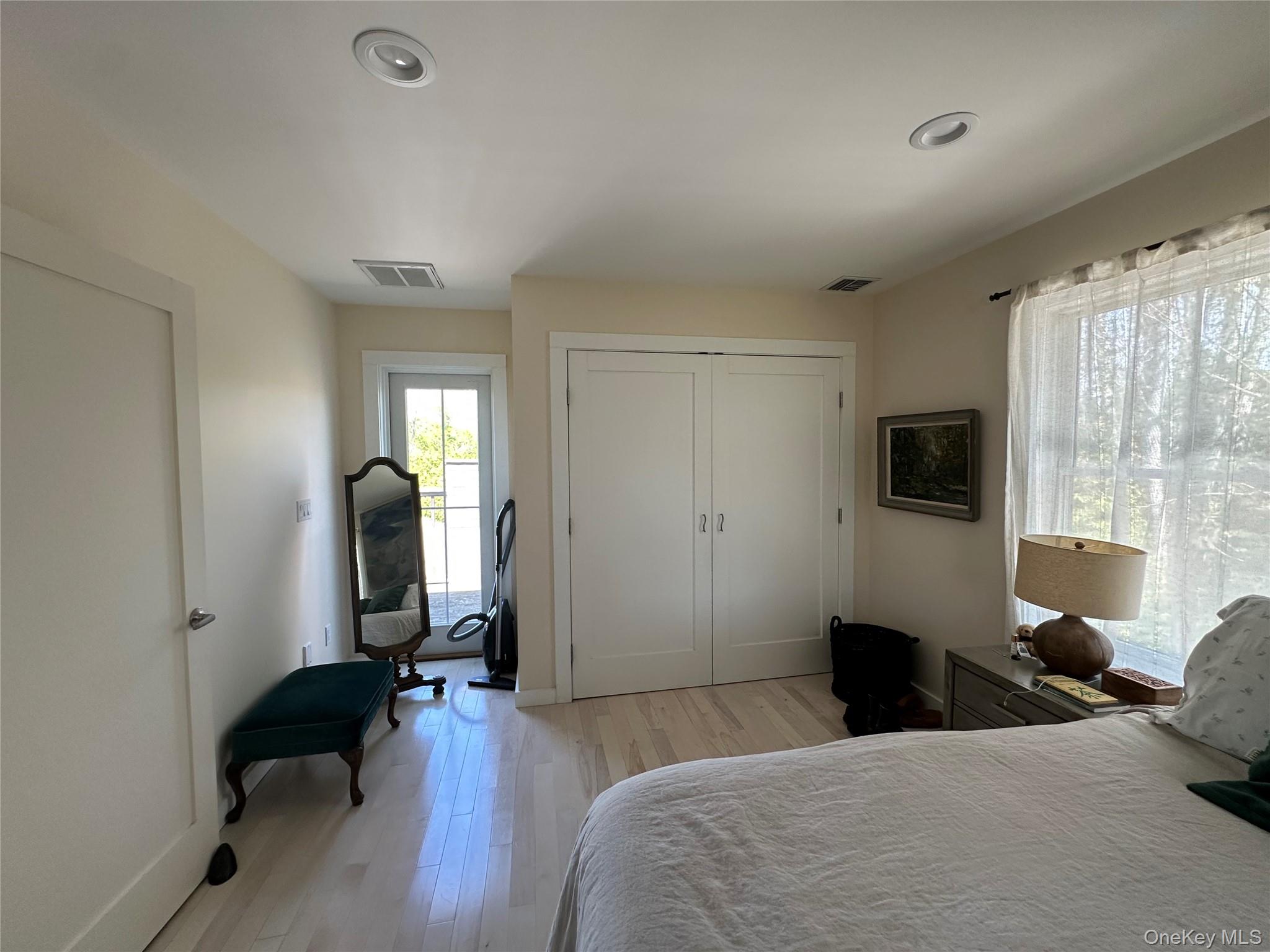 1854 North Bayview Road Southold, NY 11971 - Photo 20 of 20 Bedroom with light wood-style flooring, a closet, and recessed lighting