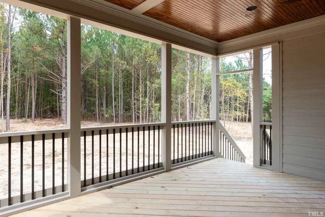 a room with a refrigerator and a window