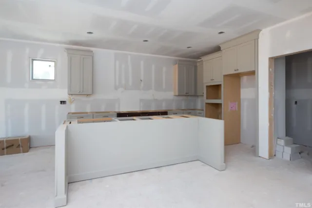 a kitchen with a cabinets and white appliances