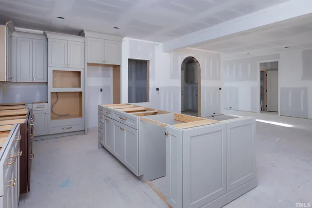 a big room with windows and a fireplace