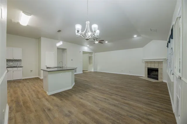 a view of kitchen and hall with wooden floor