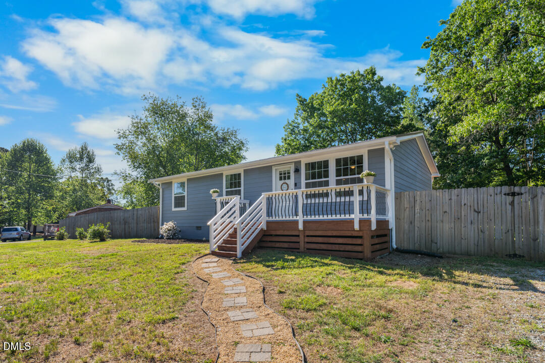 454 Cedar Creek Road Timberlake, NC 27583 - Photo 2 of 39 a front view of a house with garden
