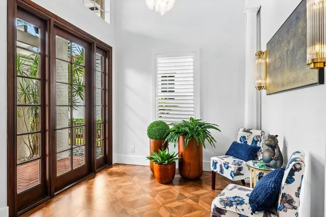 a living room filled with furniture and potted plant