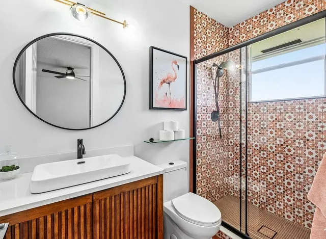 a bathroom with a sink a mirror and a toilet