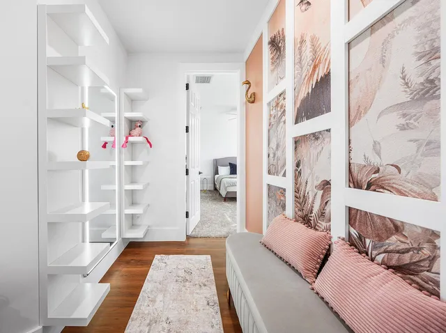 a living room with furniture and a rug