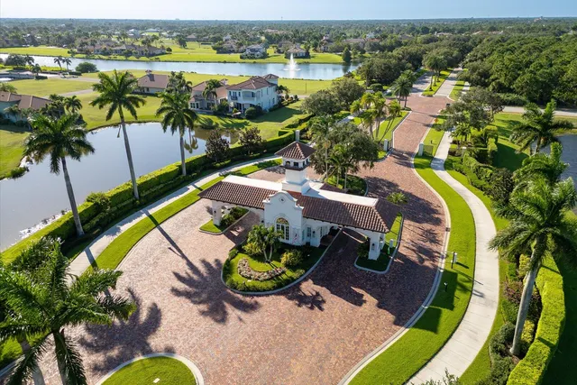 an aerial view of swimming pool with outdoor seating and city view