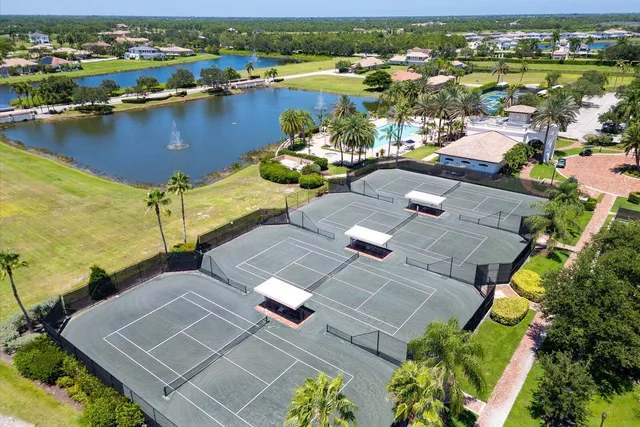 an aerial view of a house with a lake view