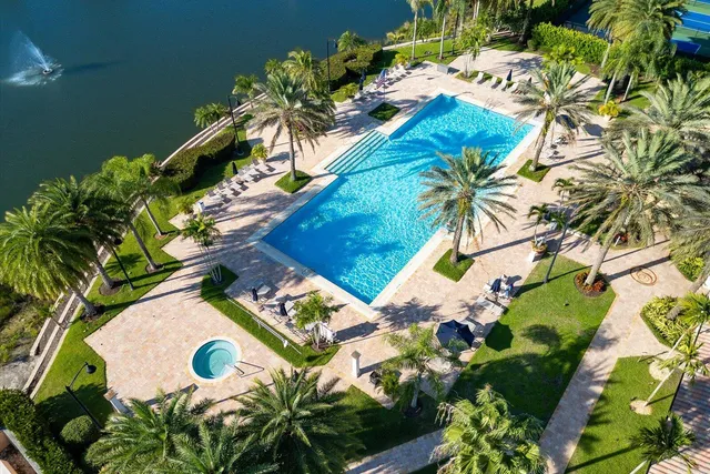 an aerial view of a house with yard