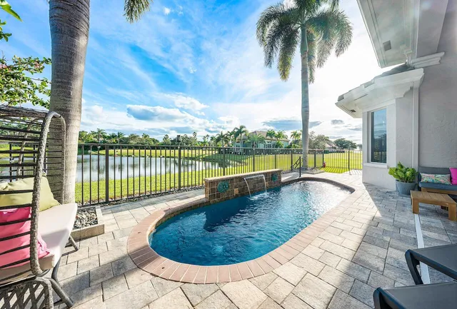 a view of a swimming pool with a lounge chair