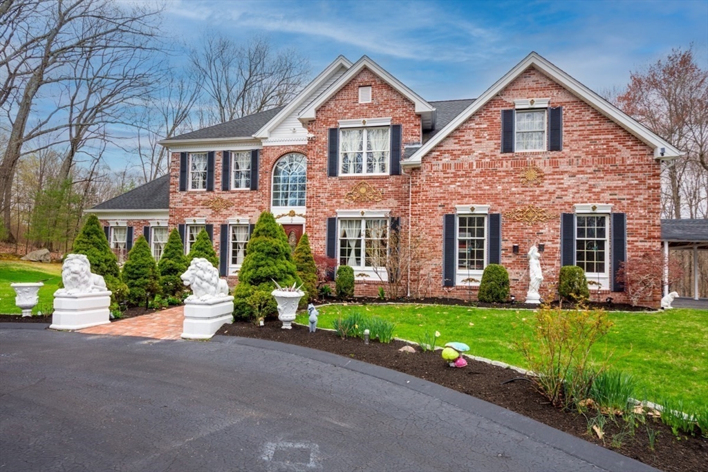 22 Robert Road Marlborough, MA 01752 - Photo 2 of 42 a front view of a house with a yard and garage