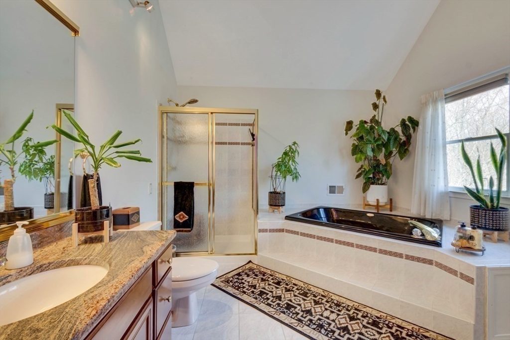 22 Robert Road Marlborough, MA 01752 - Photo 26 of 42 a living room with furniture and a potted plant