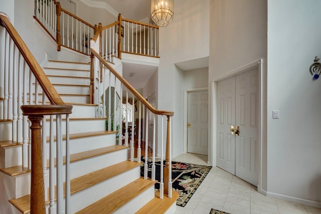 22 Robert Road Marlborough, MA 01752 - Photo 7 of 42 a view of entryway with wooden floor and stairs