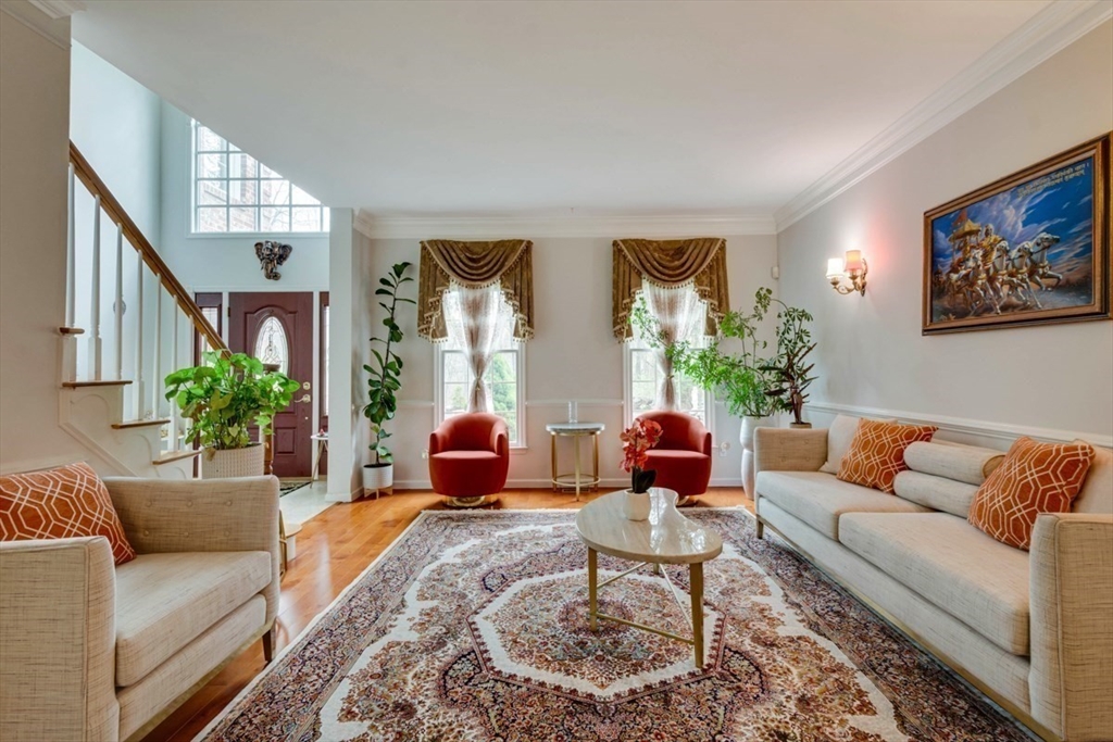 22 Robert Road Marlborough, MA 01752 - Photo 8 of 42 a living room with furniture potted plant and windows