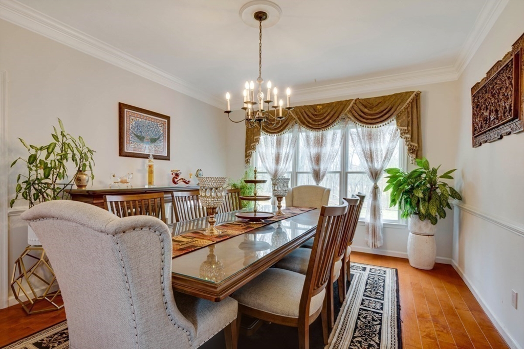 22 Robert Road Marlborough, MA 01752 - Photo 9 of 42 a living room with furniture and a chandelier