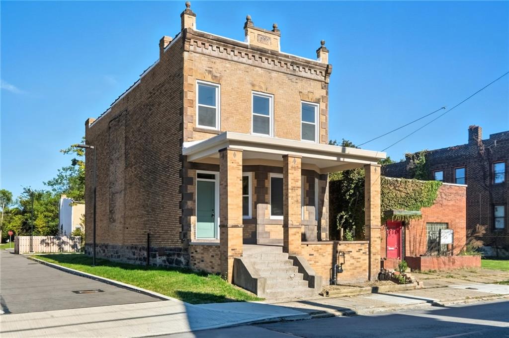 a front view of a house with garden