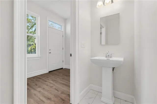 a bathroom with a sink toilet