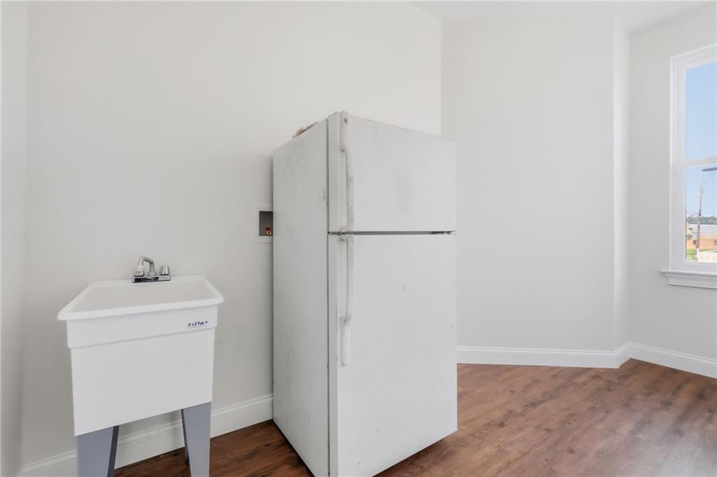 121 Shetland Street Pittsburgh, PA 15206 - Photo 18 of 37 a utility room with cabinets washer and dryer