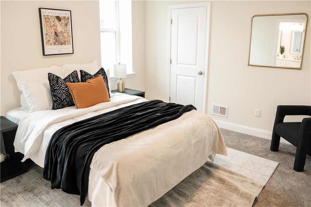 121 Shetland Street Pittsburgh, PA 15206 - Photo 20 of 37 a bedroom with bed and painting on the wall