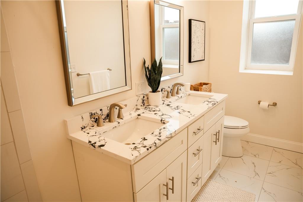 121 Shetland Street Pittsburgh, PA 15206 - Photo 24 of 37 a bathroom with a sink and a mirror