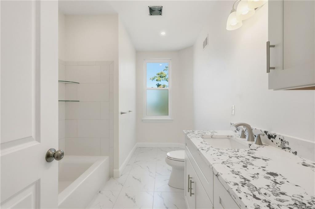 121 Shetland Street Pittsburgh, PA 15206 - Photo 28 of 37 a bathroom with a granite countertop sink a toilet and shower
