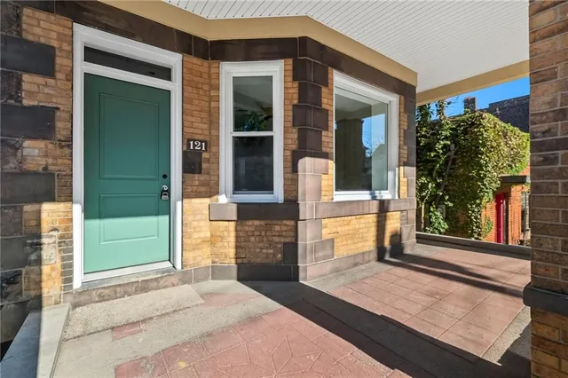 a front view of a house with a porch