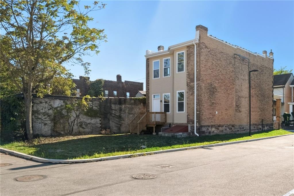 121 Shetland Street Pittsburgh, PA 15206 - Photo 36 of 37 a front view of a house with a yard