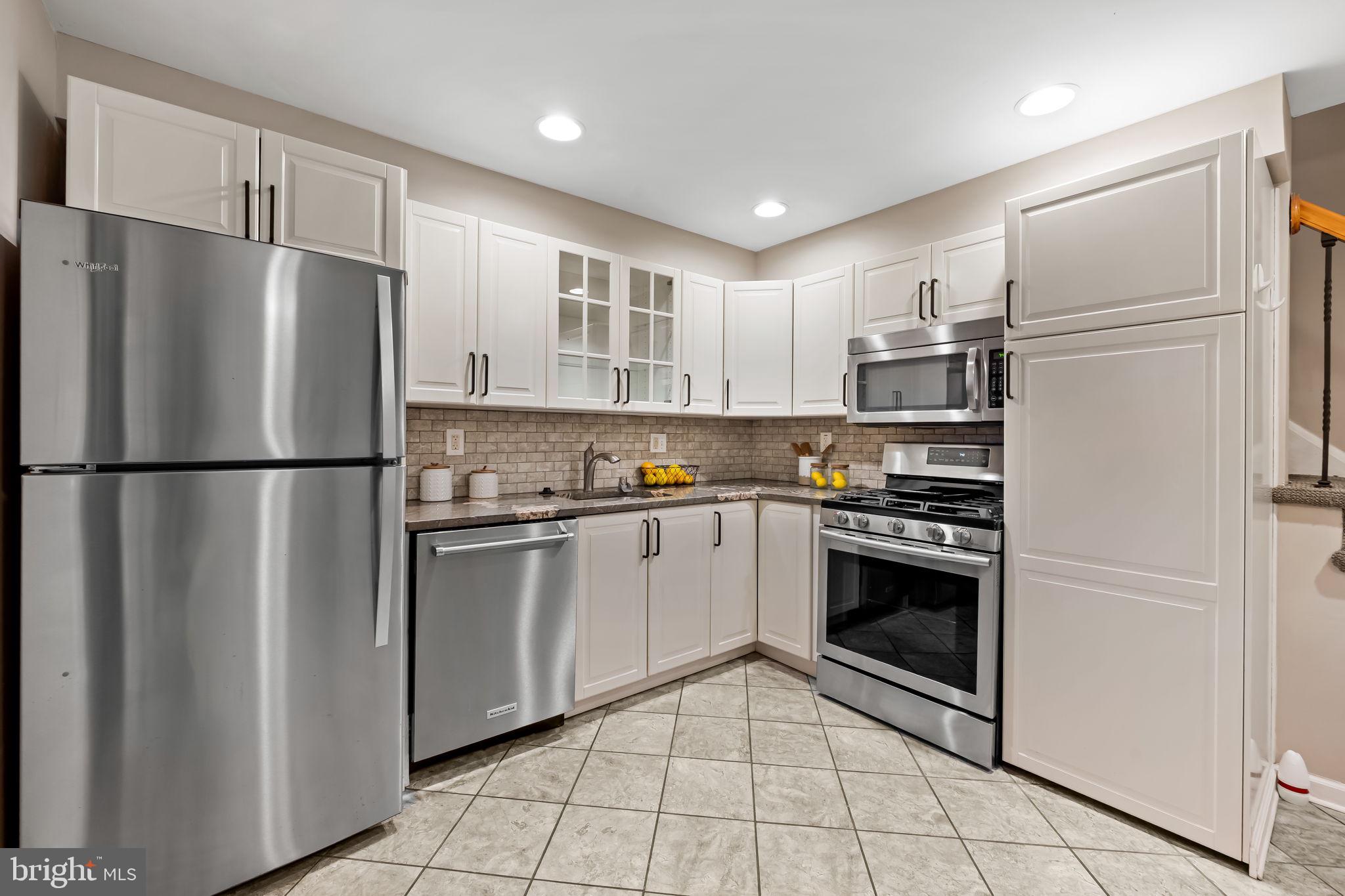 1817 Dunmere Road Baltimore, MD 21222 - Photo 10 of 27 a kitchen with stainless steel appliances granite countertop a refrigerator sink and stove