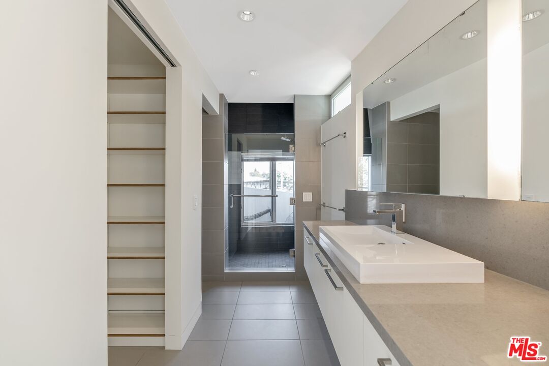 351 Sunset Avenue, Unit 1 Venice, CA 90291 - Photo 13 of 25 a bathroom with a double vanity sink and mirror