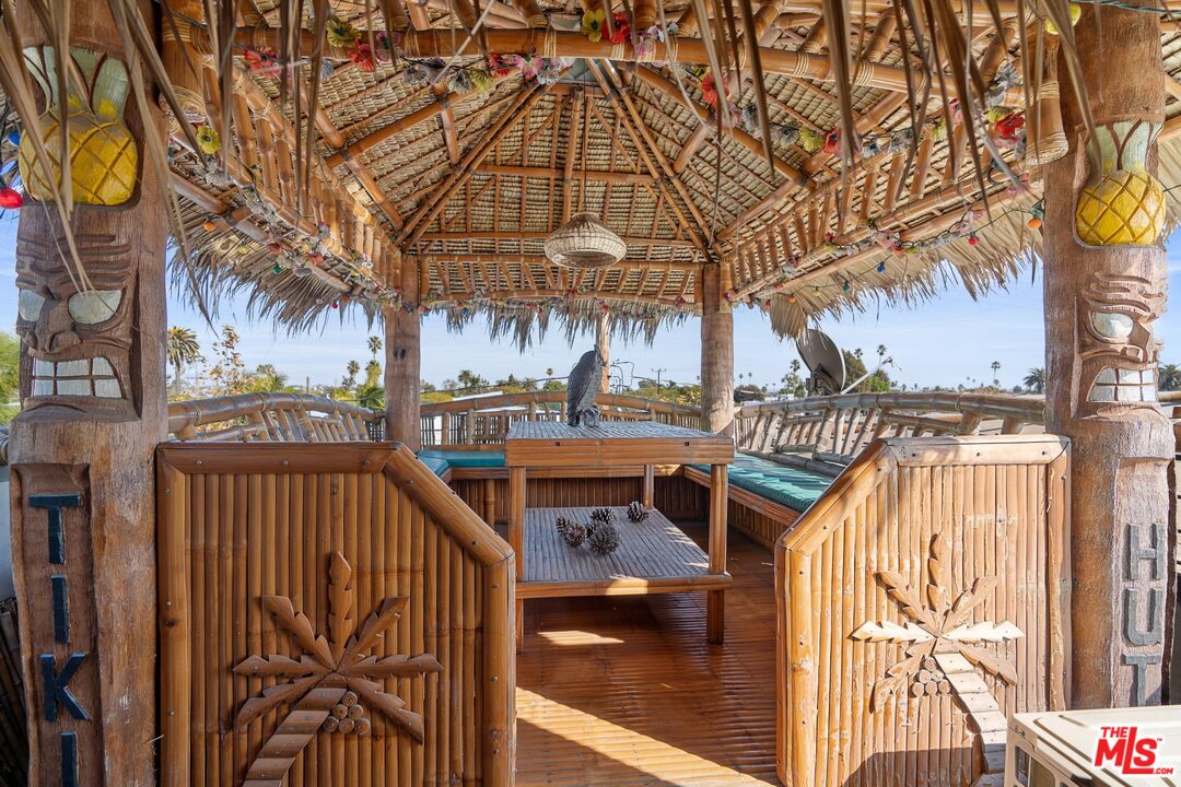 351 Sunset Avenue, Unit 1 Venice, CA 90291 - Photo 19 of 25 a view of a brick house with a small yard and large trees