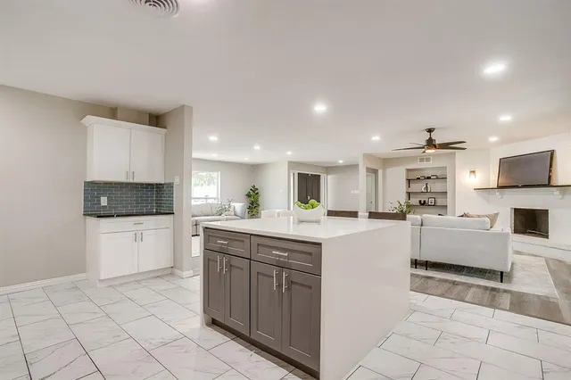 a kitchen with a sink and counter top space