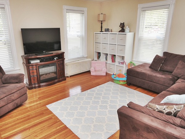 66 Winter Street Franklin, MA 02038 - Photo 11 of 30 a living room with furniture and a flat screen tv