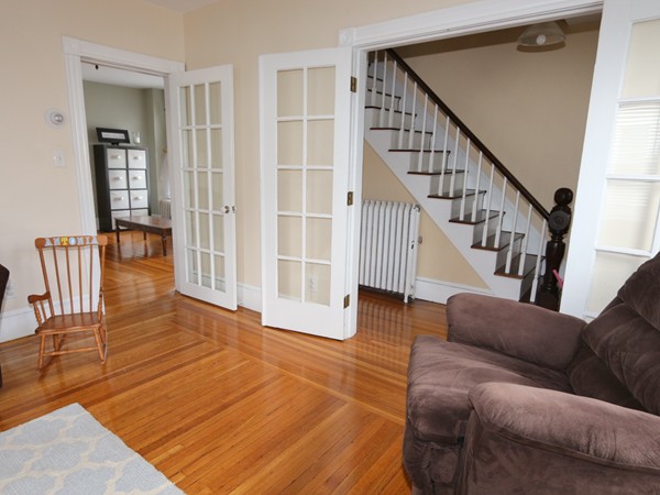 66 Winter Street Franklin, MA 02038 - Photo 12 of 30 a living room with wooden floor and stairs