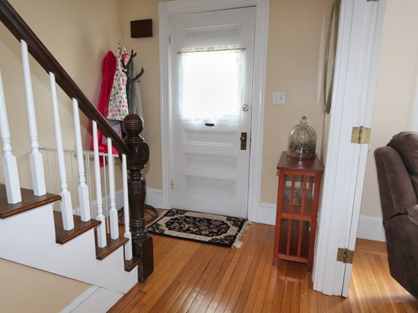 66 Winter Street Franklin, MA 02038 - Photo 23 of 30 a view of a hallway with wooden floor and staircase