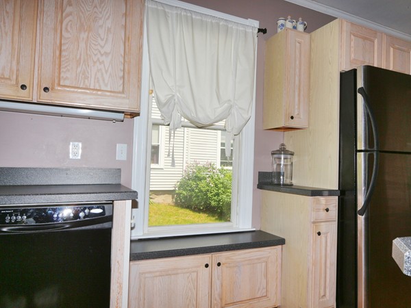 66 Winter Street Franklin, MA 02038 - Photo 5 of 30 a kitchen with stainless steel appliances granite countertop a refrigerator and a stove