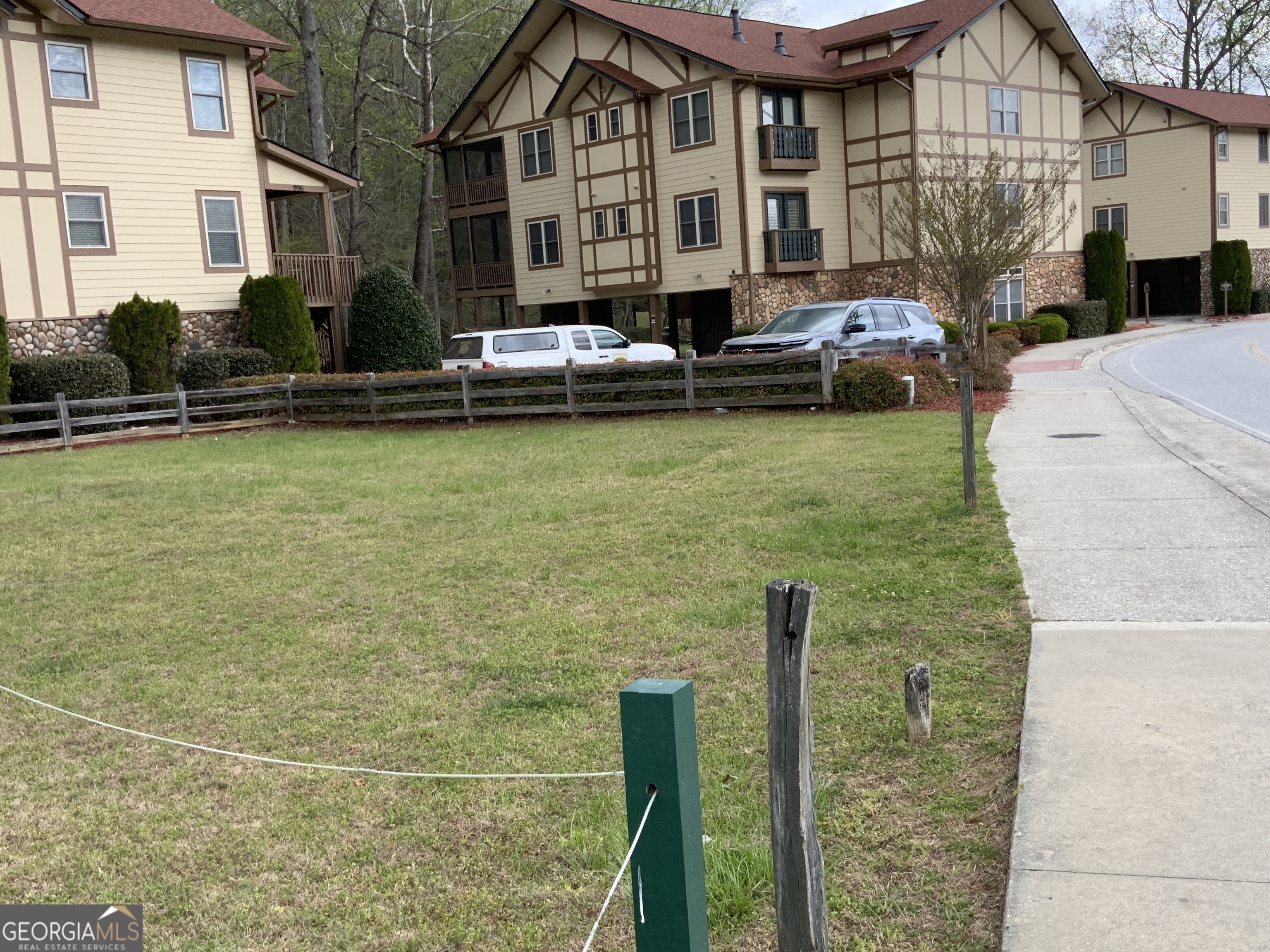 0 Edelweiss Strasse Helen, GA 30545 - Photo 2 of 8 a couple of cars parked in front of a house